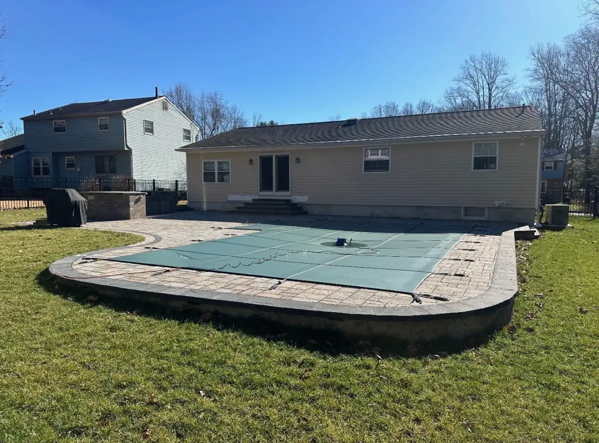Landscape renovation with new sod, mulch beds, and accent lighting
