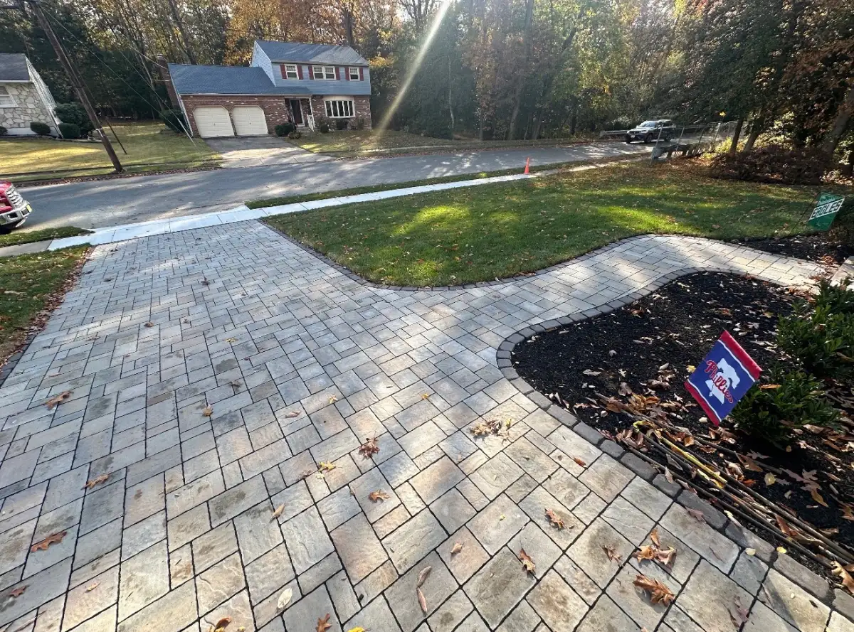 Finished backyard project with retaining wall and plantings