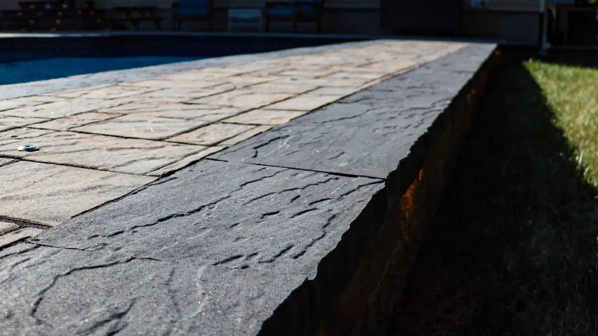 Decorative stone border along paver walkway